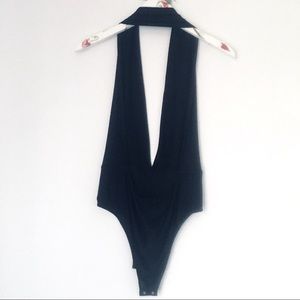 NWOT Tobi black, halter, low V bodysuit size M